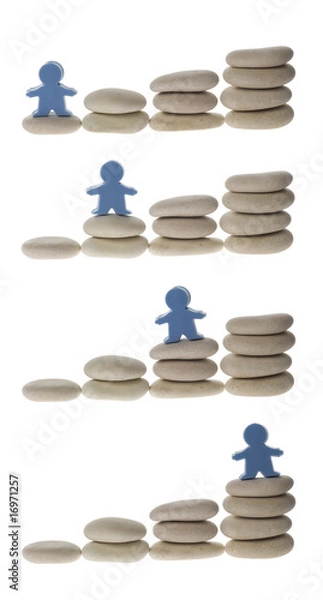 Obraz Series of figurine on different stacks of pebbles isolated