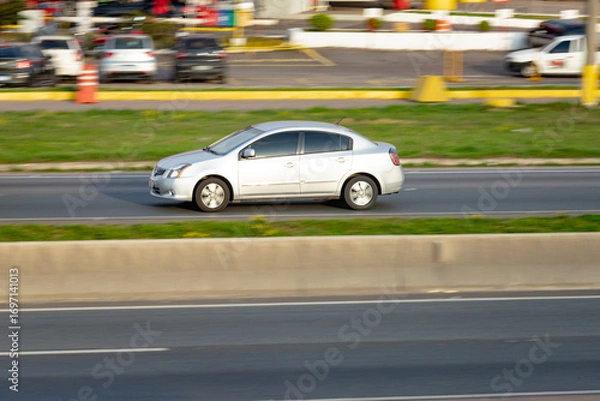 Fototapeta Highway Rhythm: Car in Full Flow