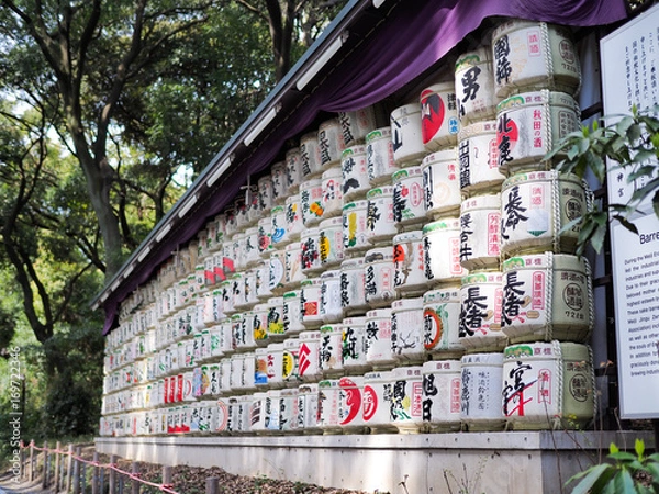 Fototapeta Barrels of sake wrapped in straw in Yoyogi Park near Meiji Shrine. The alcoholic beverage of Japanese origins made from fermented rice has a brewing process similar to beer. Toyko 2016