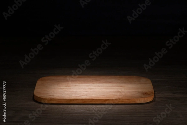 Fototapeta board Brown wooden floor in night atmosphere, dark background, light reflection on the floor, suitable for creating background images.
