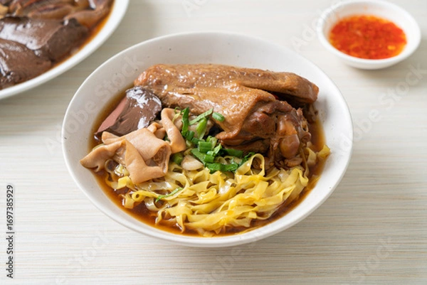 Fototapeta egg noodles with stewed and braised duck in brown soup