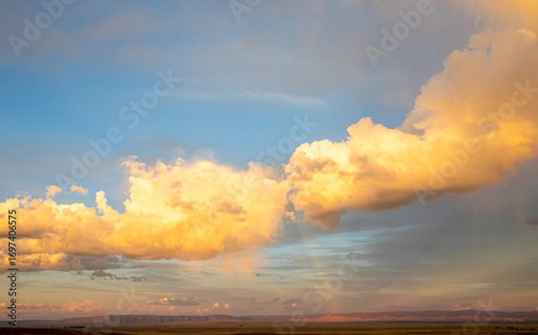 Fototapeta Magnificent reflections of colours on sunset clouds in Wyoming 