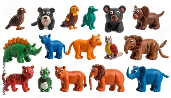 Fototapeta Colorful clay animal figurines, various species, posed in profile view, on white background