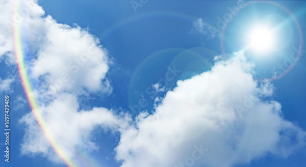 Fototapeta 夏の晴天、青空に流れる積乱雲ふわふわの入道雲と輝く太陽のレンズフレア 夏・夏休み・行楽・バカンス・アウトドア・キャンプ・天気・台風一過・紫外線・日焼け