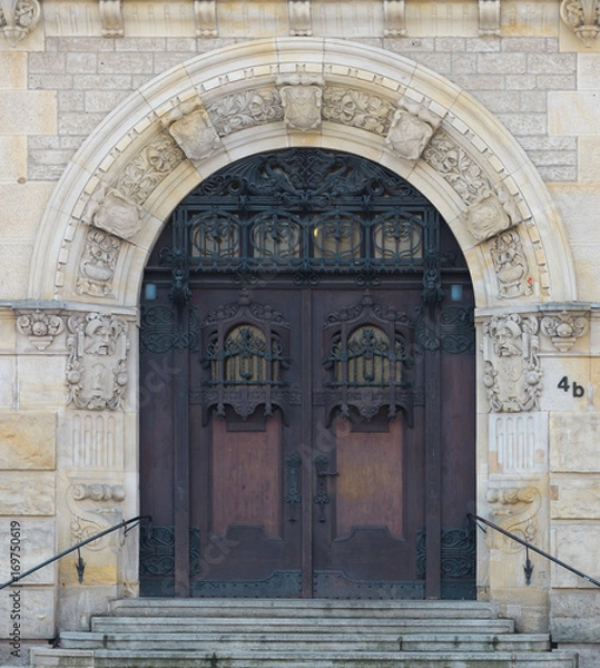 Obraz old massive wooden door in an old german town