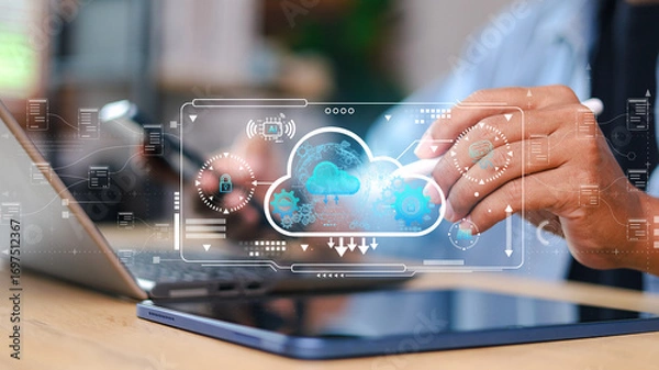 Fototapeta Cloud computing and data security concept with businessman using laptop and digital tablet. Futuristic technology, secure data storage, AI, and information system.