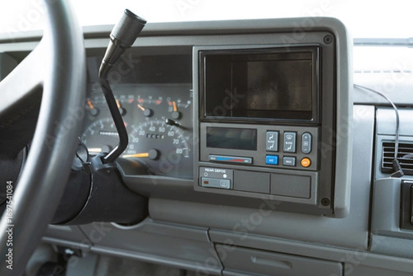 Fototapeta 1990s full size American 4x4 SUV with 5.7L V8 interior dashboard and instrument cluster, showing analog gauges, odometer, climate controls, switches, and classic design details