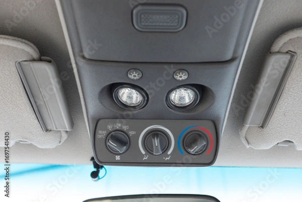 Fototapeta 1994 full size American 4x4 SUV with 5.7L V8 interior overhead console featuring dome lights and climate control dials for fan speed, airflow, and temperature adjustment