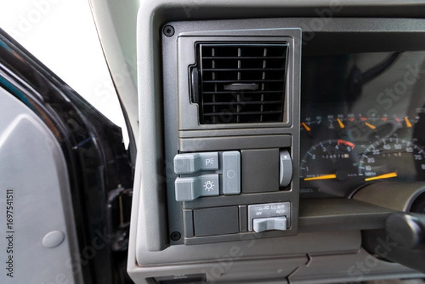 Fototapeta 1990s full size American 4x4 SUV with 5.7L V8 interior dashboard and instrument cluster, showing analog gauges, odometer, climate controls, switches, and classic design details