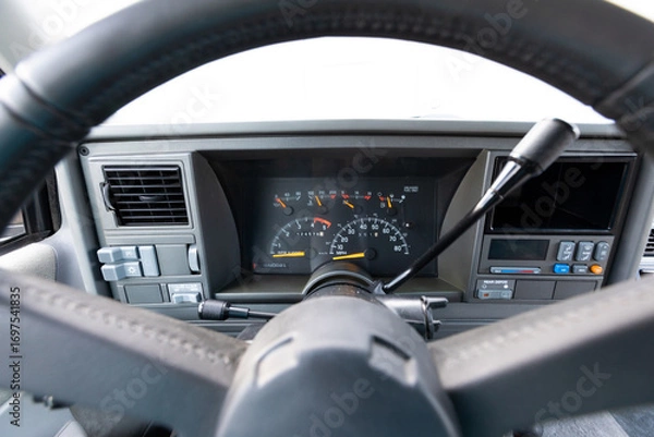 Fototapeta 1990s full size American 4x4 SUV with 5.7L V8 interior dashboard and instrument cluster, showing analog gauges, odometer, climate controls, switches, and classic design details