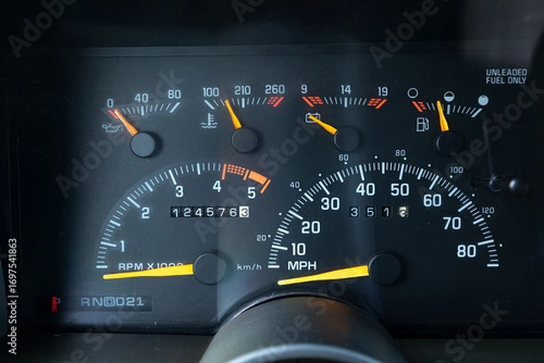 Fototapeta 1990s full size American 4x4 SUV with 5.7L V8 interior dashboard and instrument cluster, showing analog gauges, odometer, climate controls, switches, and classic design details