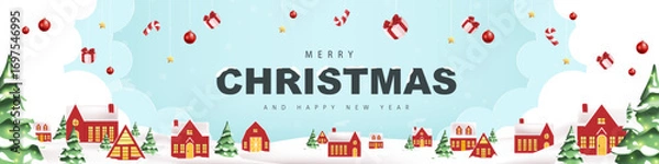 Fototapeta Merry christmas and happy new year greeting card banner with snowy winter landscape red village and forest mountain scene for holiday celebration and festive background