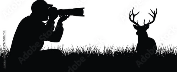 Fototapeta Silhouette of a photographer taking a picture of a deer, capturing wildlife