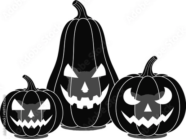 Fototapeta Three spooky halloween pumpkins with glowing eyes, creating a festive and eerie atmosphere