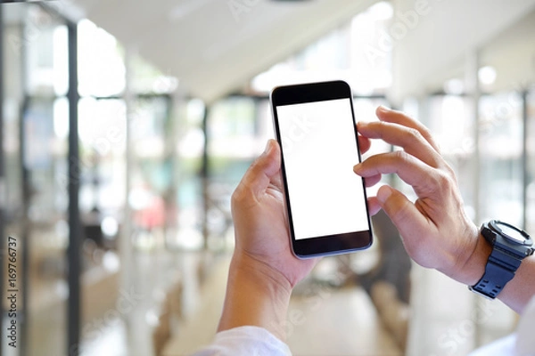 Fototapeta Business man using Smartphone. Blank screen mobile phone for graphic display montage.