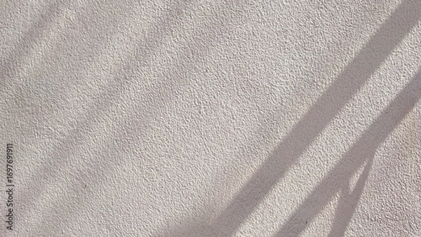 Fototapeta Rough texture of raw concrete wall background with sunlight and shadow on surface