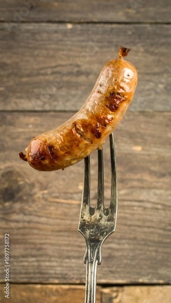Obraz Grilled sausage on fork