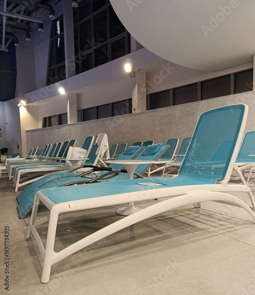 Fototapeta sun loungers near the pool, relaxation area in the spa center