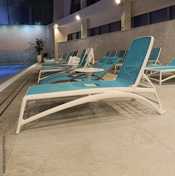 Fototapeta sun loungers near the pool, relaxation area in the spa center