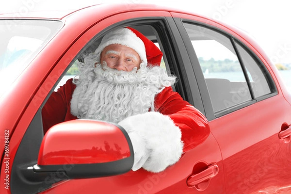 Obraz Authentic Santa Claus looking out of car window