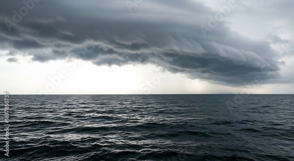 Fototapeta Dark ominous clouds dramatically loom over a restless ocean under a muted light. AI Generated