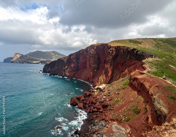 Obraz Red cliffs meet the sea. Dramatic coastal scene