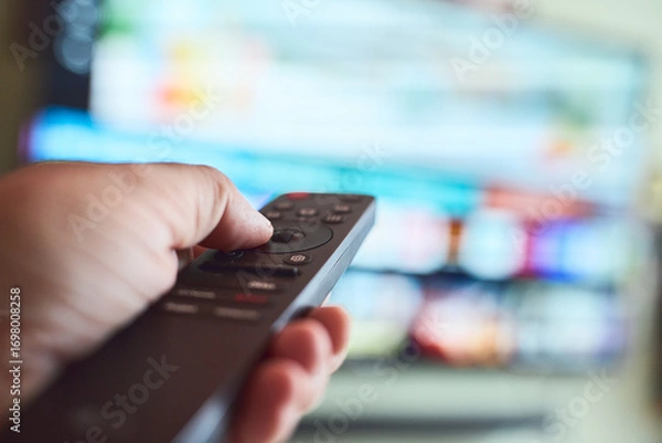 Obraz Controlling the television with a remote