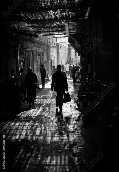 Obraz Marrakech man walking in shadow