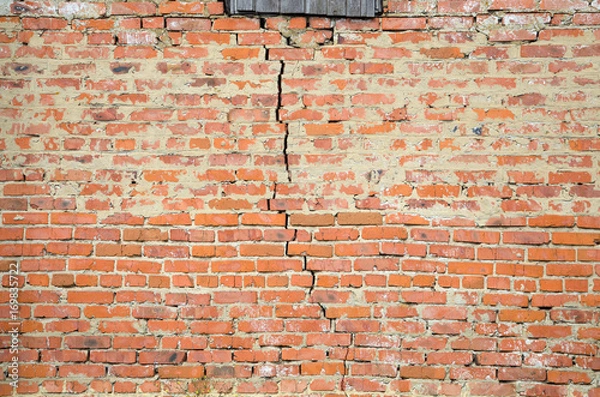 Fototapeta Red brick wall background with big crack