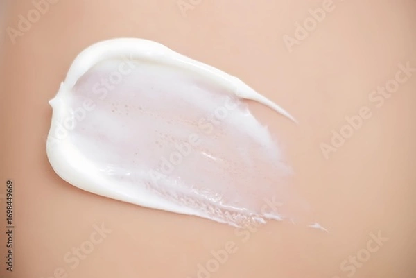 Obraz Closeup of White Cream Swirl on Peach Background