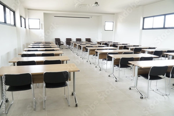 Fototapeta Large room with many desks and chairs