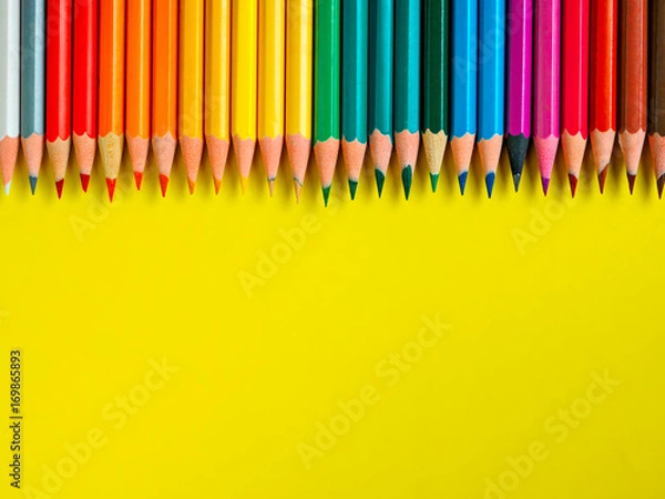 Fototapeta Colored pencil on yellow paper background for drawing color circle