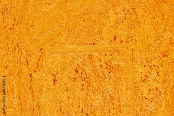 Fototapeta Orange fiberboard background wood processing waste texture pressed wood bright