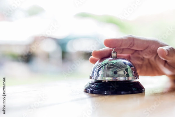 Fototapeta Service Bell. Person using their finger to ring a counter bell.