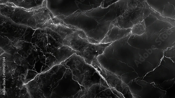 Fototapeta Black marble texture with intricate white veining creates dramatic and elegant background. dark surface evokes sense of depth and sophistication