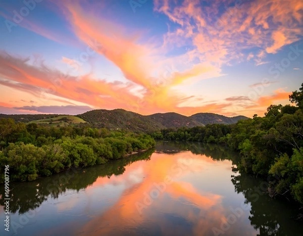 Obraz Serene river sunset reflecting vibrant clouds