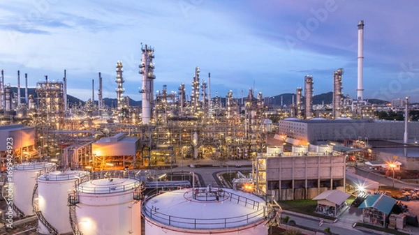 Fototapeta Aerial view oil and gas refinery plant at night, Global business energy logistic transportation, Oil and gas refinery petrochemical industrial, Petrochemical refinery industrial energy supply chain.