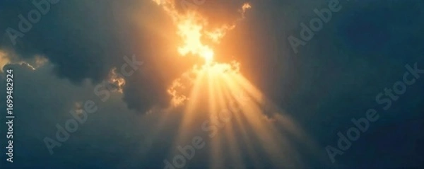 Fototapeta Intense beam of sunlight piercing through dark clouds, creating a dramatic, bright light effect Perfect for backgrounds, overlays, or cinematic projects , vibrant, majestic