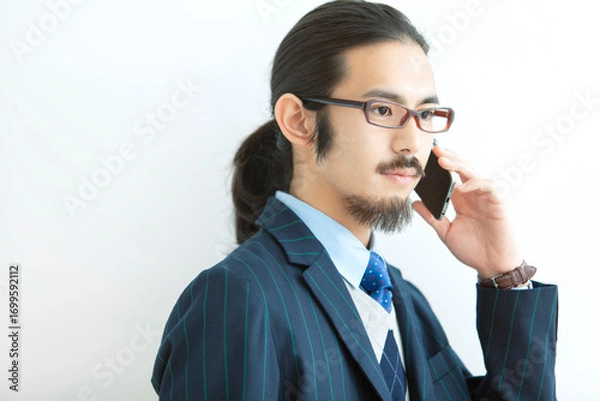 Fototapeta 電話をするビジネスマン