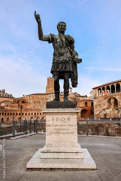 Obraz View of Statue of Roman Emperor Trajan at Roman Forum on famous Via dei Fori Imperial of Rome, Italy. Vertical photo. High quality photo