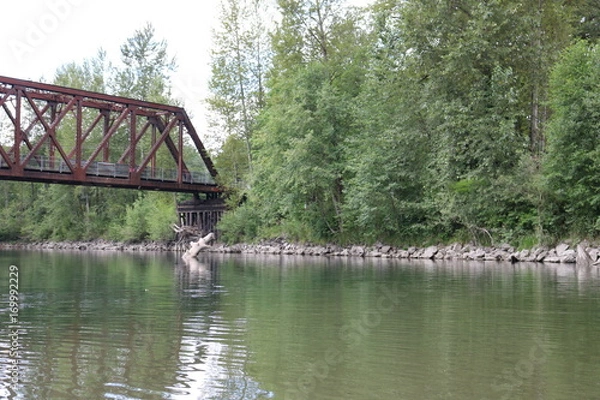 Obraz Bridge over a calm river