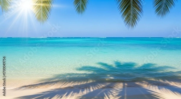 Fototapeta Tropical beach with turquoise water palm shadows and a bright sun