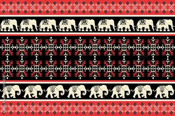 Fototapeta Festive ethnic pattern with decorative elephants, snowflakes, and geometric designs in red, green, and cream on black background, perfect for Christmas and holiday themes.
