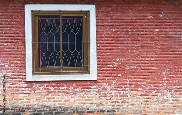 Fototapeta Red brick wall with a window.