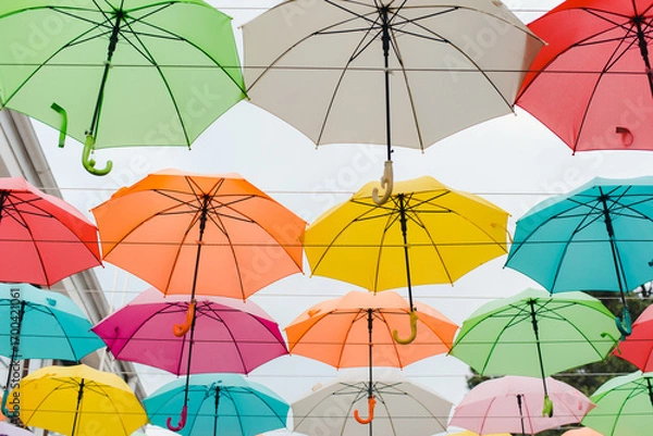 Fototapeta colorful umbrellas background. Colored umbrellas. Sky of colored umbrellas. Decor of umbrellas.