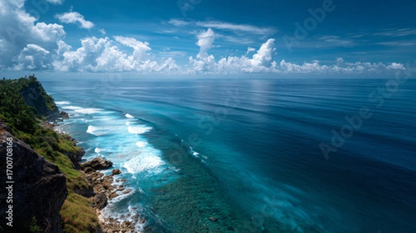 Fototapeta "Ocean view from elevated point with clear blue sky and calm sea in the background