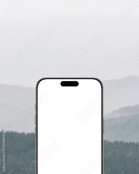 Fototapeta Smartphone mockup with blank white screen against misty mountain background
