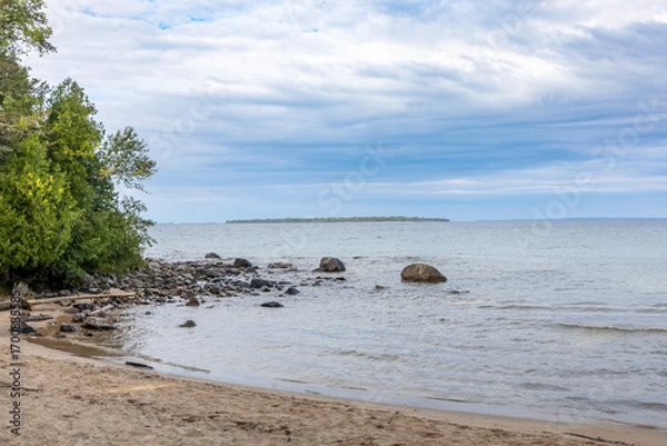 Obraz Katherine Cove offers a tranquil escape with its pristine sandy shores and lush forest backdrop along Lake Superior.