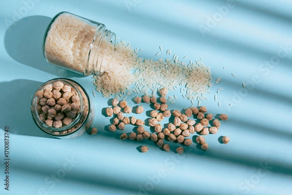Obraz Flat lay photograph of natural cereals and grains, including oats, rice, and chickpeas, in a clean composition with natural light.