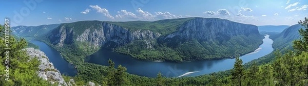 Fototapeta Panoramic view of the Danube River flowing through a lush, green valley.